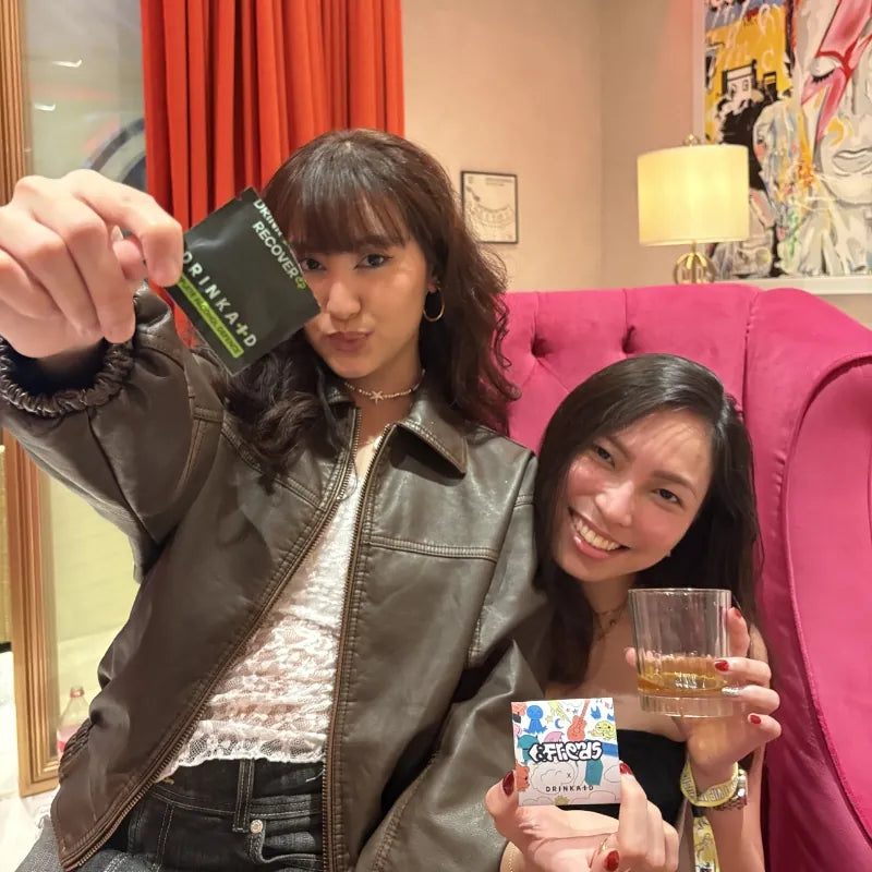 Kimberly Yao and her friends are holding DrinkAid Complete Alcohol Defense when drinking alochol